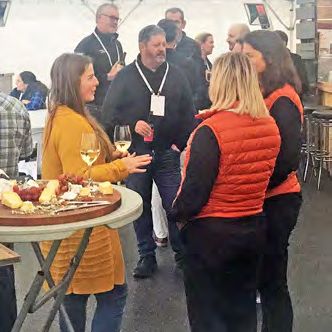 Guests chatting over drinks at a networking event